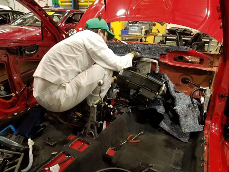 Gutting the interior for roll cage installation.